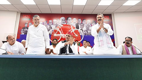 New SP candidates Akash Agarwal (L) and Sanjayan Tripathi, with SP chief Akhilesh Yadav.