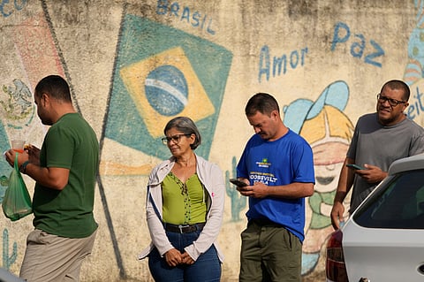 Voters line up at a polling station during general elections in Brasilia, Brasilia, Sunday, Oct. 4, 2026.