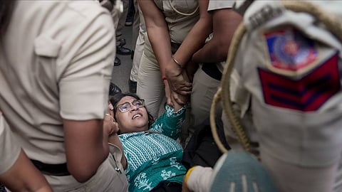 A demonstrator being detained by police personnel during a protest against Chief Election Commissioner (CEC) Gyanesh Kumar, demanding his resignation over the alleged irregularities in the Special Intensive Revision (SIR) of electoral rolls and mass deletion of voters, at Jantar Mantar, in New Delhi, Saturday, Oct. 3, 2026.
