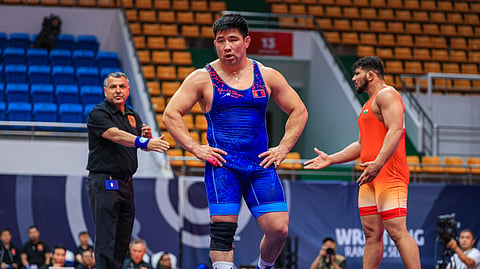 Mongolia's Gankhuyag Ganbaatar (C) competes in the 97kg weight category of the freestyle and Greco-Roman wrestling