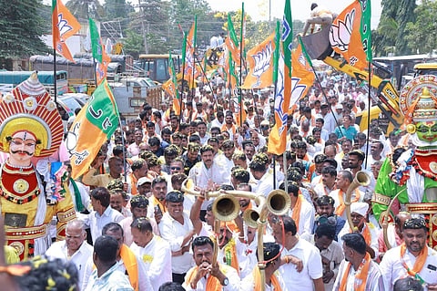 Karnataka BJP president BY Vijayendra and party workers take out a rally in Gubbi taluk, Tumakuru district, on Sunday