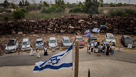 People visit a memorial made up of the vehicles that were burned and damaged during the Oct. 7 cross-border attack by Hamas militants three years prior, on the outskirts of Netivot in southern Israel, Wednesday, Sept. 30, 2026