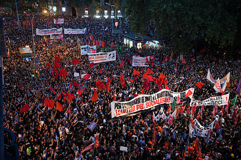 Tens of thousands march protesting the housing situation in Spain, just hours after Prime Minister Pedro Sánchez announced an early general election, in Barcelona, Spain, Monday, Oct. 5, 2026.