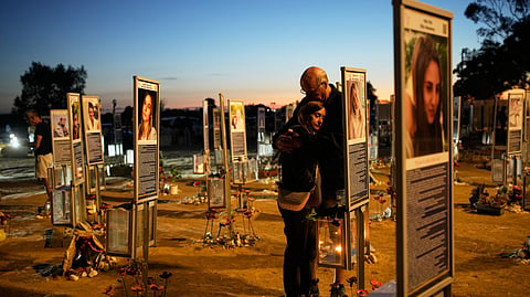 Benny and Maggy Solomon, parents of Hila Solomon, who was killed in the Oct. 7, 2023, Hamas attack on Israel, attend a memorial marking the third anniversary of the attack at the Nova music festival site near Kibbutz Reim, southern Israel, Wednesday, Oct. 7, 2026.