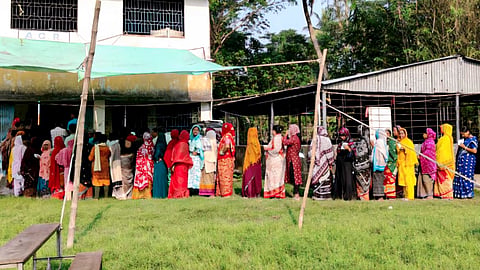 Women voters line up in a queue outside a polling station to cast their votes during the Assembly by-election in Nandigram constituency, Purba Medinipur district, West Bengal, Tuesday, Oct. 6, 2026
