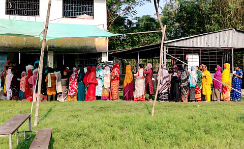 Women voters line up in a queue outside a polling station to cast their votes during the Assembly by-election in Nandigram constituency, Purba Medinipur district, West Bengal, Tuesday, Oct. 6, 2026.