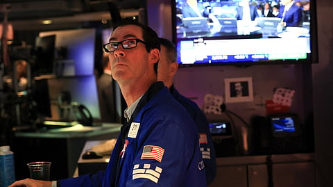 A trader works on the floor of the New York Stock Exchange (NYSE) at the opening bell, in New York City on October 5, 2026.