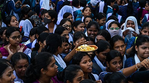 Biriyani being distributed among students of Ramadevi Women's University as the Students Union Election returned to the college campus after eight years, in Bhubaneswar on Wednesday