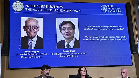 Portraits of Henri Kagan and Kenso Soai are shown on the screen as they are awarded the 2026 Nobel Prize in Chemistry at the Royal Swedish Academy of Sciences in Stockholm, Sweden, on Oct. 7, 2026.