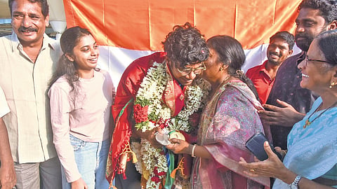 Mother of B Dheeraj-Asian Games Silver medalist in Archery shares an emotional moment on his arrival at Vijayawada International Airport.