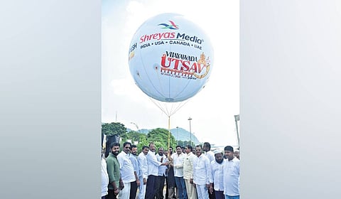 TDP leader Budda Venkanna and others releasing Vijayawada Utsav air balloon at Punnami Ghat.
