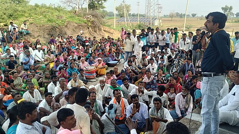 An official speaks to farmers in a Gadag village on Tuesday.