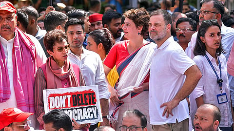 Lok Sabha LoP Rahul Gandhi and Congress MPs Priyanka Gandhi Vadra and Selja Kumari during the INDIA bloc-led protest march from Parliament House to Nirvachan Sadan, demanding Chief Election Commissioner Gyanesh Kumar's resignation over the alleged irregularities in the electoral roll, in New Delhi on Tuesday. RJD MP Manoj Kumar Jha and TMC MP Abhishek Banerjee present.