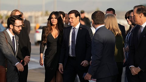 U.S. Secretary of State Marco Rubio, center, and U.S. Ambassador to Greece Kimberly Guilfoyle stand at Eleftherios Venizelos International Airport near Athens, Greece, before Rubio boards a plane , Thursday, Oct. 8, 2026.