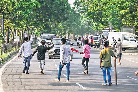 Protesters blocking vehicles at Master Canteen Square during the Odisha bandh called by INDIA bloc demanding withdrawal of MMDR Act, and resignation of CEC Gyanesh Kumar & SME min Nityananda Gond, in Bhubaneswar.