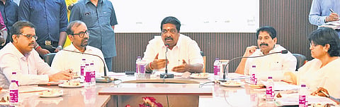 Minister B Rajkumar chairs a consultation meeting with officials and residents at TNUHDB headquarters on Thursday
