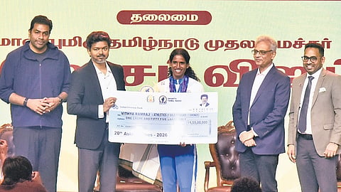 Chief Minister C Joseph Vijay honours Asian Games gold medallist Vithya Ramraj at a function organised by SDAT, in Chennai, on Thursday
