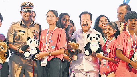 Home Minister Ramesh Chennithala distributes soft toys to children participating in the Kids Globe programme in the presence of DGP Ravada Chandrasekhar and Vigilance and Anti-Corruption Bureau Director Manoj Abraham in Kochi on Thursday.