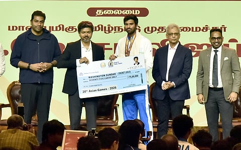 Washington Sundar receives a cheque of Rs 75 lakh from Chief Minister C Joseph Vijay