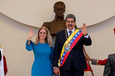 Venezuelan President Nicolas Maduro and his wife Cilia Flores wave after his swearing-in ceremony for a third term at the National Assembly in Caracas, Venezuela, on January 10, 2025.