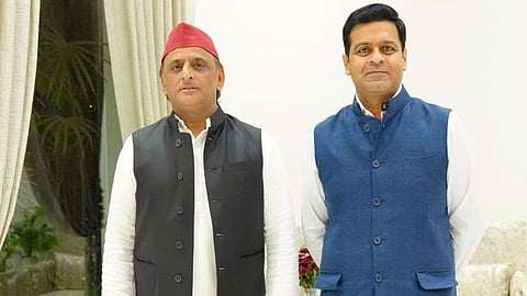 Reliance Industries Group President Dhanraj Nathwani (right) thanks SP chief Akhilesh Yadav (left) for 'trust and confidence' after filing Rajya Sabha nomination as SP candidate.