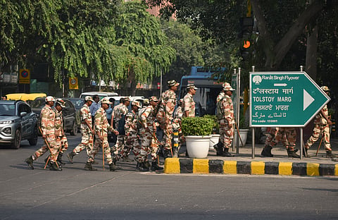 Security personnel keep a vigil ahead of the INDIA bloc's march to Rashtrapati Bhavan to seek President Droupadi Murmu's intervention over its demand for Chief Election Commissioner Gyanesh Kumar's resignation, at Janpath, in New Delhi, Friday, Oct. 9, 2026. More than 20,000 police and paramilitary personnel have been deployed across central Delhi, where the Cockroach Janata Party (CJP) too has announced another protest on Saturday, this time against Kumar.