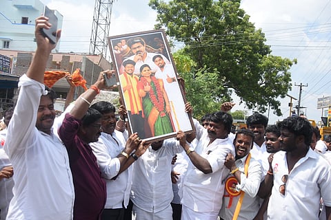 Tvk cadres celebrate outside the counting centre at Chengalpattu after their party candidate Maragarham kumaravel leads the by poll election in Maduranthakan constituency.