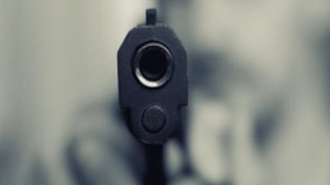 The woman, a mother of five children, received gunshot wounds near her neck and died within minutes.