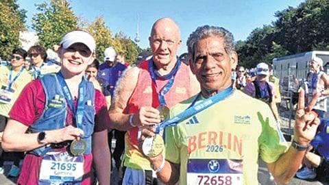 Dukhishyam Padhy showing his medal after completing Berlin Marathon
