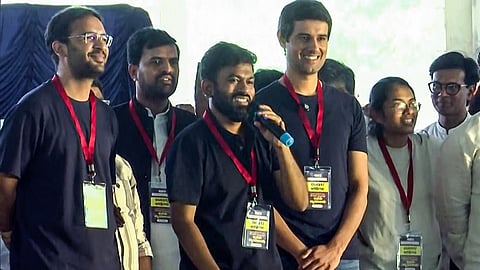 YouTuber Dhruv Rathee (R) participates in CJP's protest against the Special Intensive Revision (SIR) and Chief Election Commissioner Gyanesh Kumar at Freedom Park, in Bengaluru, on Thursday, Oct. 08, 2026.