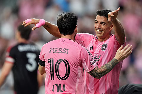 Inter Miami forward Luis Suarez, right, celebrates with forward Lionel Messi after scoring his side's second goal during the first half of an MLS soccer match against D.C. United, Saturday, Oct. 10, 2026, in Miami.