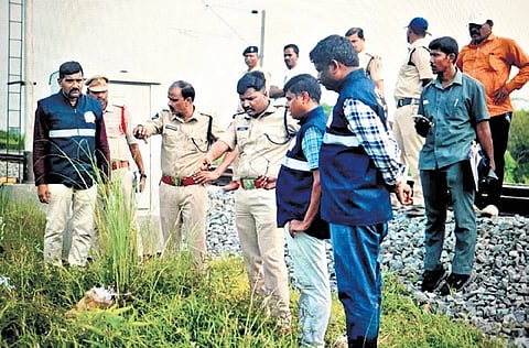 Visakhapatnam Deputy Superintendent of Railway Police (DSRP) K Pramod conducting an investigation near the railway track between Dusi and Ponduru railway stations in Srikakulam district