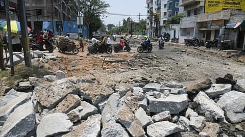 Commuters navigate through a under-repair road near Moula Ali in Secunderabad.