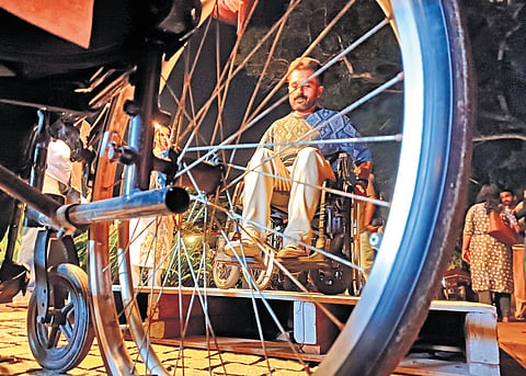 A man using a wheelchair during an awareness programme organised by CanWalk Society and SP Adarsh Foundation at Manaveeyam Veedhi