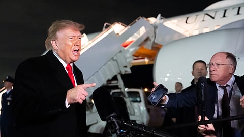 US President Donald Trump speaks with reporters as he arrives on Air Force One, Saturday, Oct. 10, 2026, at Joint Base Andrews, Md.