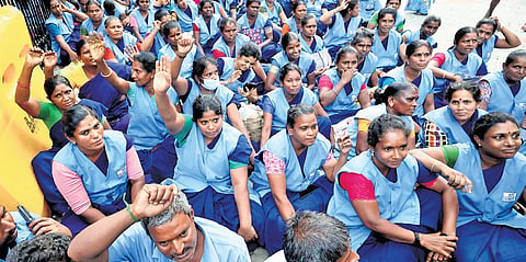 Contract workers at Madurai Government Rajaji Hospital stage a protest in front of the facility on Monday, seeking job regularisation and a pay hike.