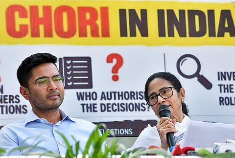 TMC Chief Mamata Banerjee addresses a press conference, in New Delhi. TMC MP Abhishek Banerjee also present