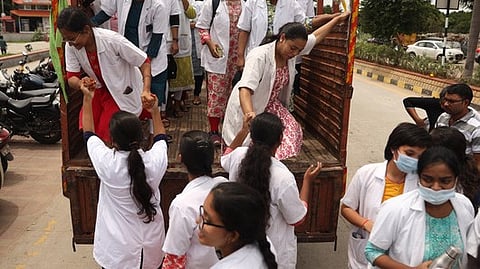 File Image: Members of Telangana Junior Doctors Association arrive in a truck to take part in a protest rally at Necklace Road.