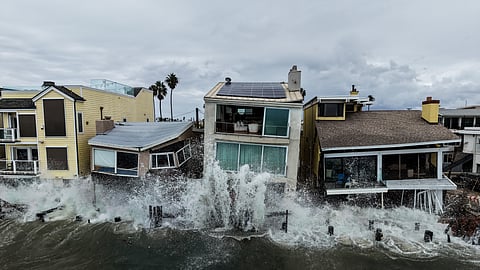 Waves from post-tropical cyclone Rachel crash into beachfront homes in Long Beach, Calif., Monday, Oct. 12, 2026.