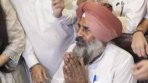 Pargat Singh (seated), an Olympian and former captain of the Indian hockey team, greets the gathering after taking charge as the new Punjab Congress President during a ceremony at Punjab Congress Bhawan, in Chandigarh. Former Punjab chief minister Charanjit Singh Channi is also seen