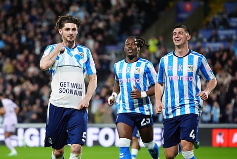 Coventry City's Jack Rudoni, left, celebrates after scoring the opening goal during the English Premier League soccer match between Coventry City and Newcastle United in Coventry, England, Monday, Oct. 12, 2026.