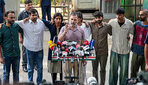 Congress leader Rahul Gandhi with NSUI President Vinod Jakhar, content creator Ramit Verma and other protesters, who were allegedly injured amid crackdown by police in the recent protests against Chief Election Commissioner (CEC) Gyanesh Kumar, during a press conference after their meeting, in New Delhi, Wednesday, Oct. 14, 2026.