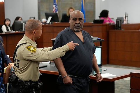 Duane Davis, center, arrives for a sentencing hearing after his murder conviction in the death of rapper Tupac Shakur on Tuesday, Oct. 13, 2026, in Las Vegas