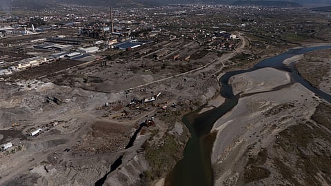This aerial photo shows machines working in waste dumps at the former metallurgical plant in Elbasan, on March 7, 2025.