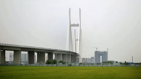 A new bridge connecting North Korea and China, seen from the North Korean side of the Yalu River border, on Sept. 2, 2014, where it touches down in rice fields in Sinuiju, North Korea.