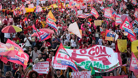 Supporters of Brazilian President Luiz Inacio Lula da Silva, who is running for reelection, march during a rally ahead of the presidential runoff election in Brasilia, Brazil, Tuesday, Oct. 13, 2026.