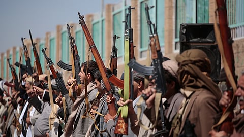 Houthi supporters carry their rifles while attending an armed tribal rally in Sanaa, Yemen, Wednesday, Oct. 7, 2026.