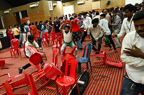 Chairs being vandalised in the convocation hall at Utkal University during clash between ABVP and BCJD members on Wednesday.
