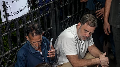 Lok Sabha Leader of Opposition (LoP) Rahul Gandhi with the parents of Ankita Bhandari during a sit-in protest at India Gate, in New Delhi, Wednesday, Oct. 14, 2026. LoP Rahul Gandhi and Priyanka Gandhi joined the family to express solidarity with their demand to put on hold the gubernatorial appointment of a BJP leader whose name they allege is linked to the case.