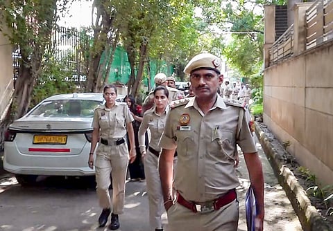 Police personnel outside the residence where Cockroach Janta Party (CJP) founder Abhijeet Dipke is staying, ahead of the party's 'Lehra Do Tiranga' rally, in New Delhi, Friday, Oct. 16, 2026.